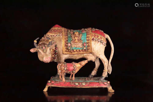 A COPPER GILT BULL SHAPED FIGURE