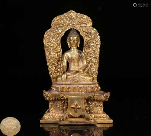 A GILT BRONZE MOLDED SHAKYAMUNI BUDDHA STATUE