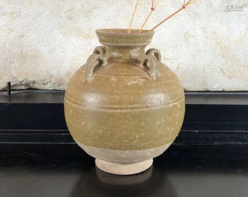 A GLOBULAR SHAPED JAR WITH FOUR EARS