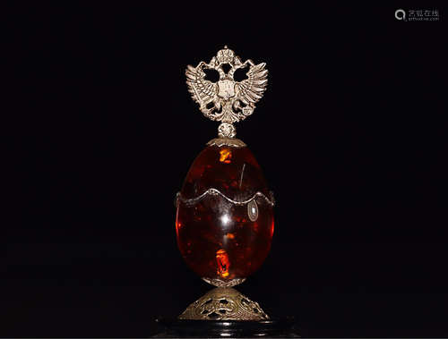 AN AMBER ORNAMENT