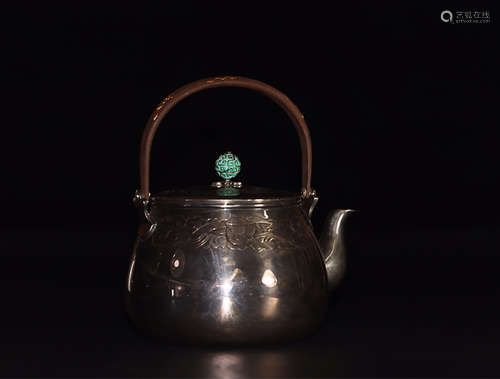 A CRANE PATTERN SILVER TEAPOT