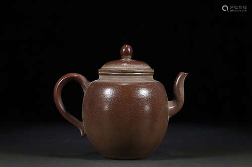 A PURPLE CLAY TEAPOT