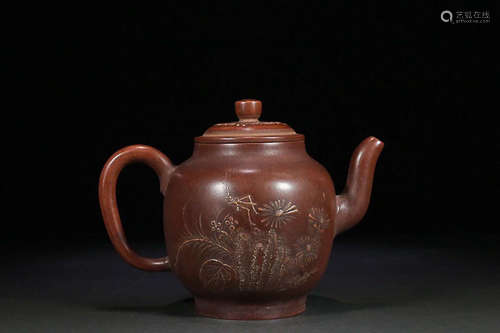 A PURPLE CLAY TEAPOT