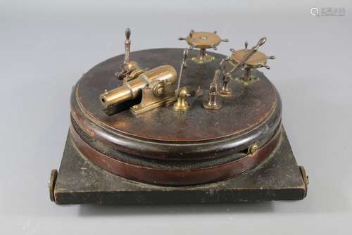 A Georgian Mahogany and Bronze Miniature Desk Cannon