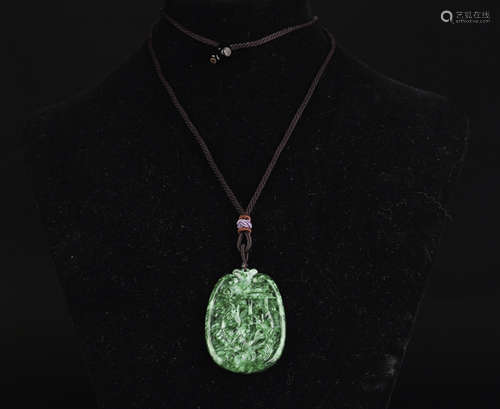 A JADEITE CARVED WRAPPED FLORAL PATTERN PENDANT