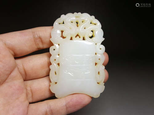 A HETIAN JADE BEAST PATTERN PENDANT