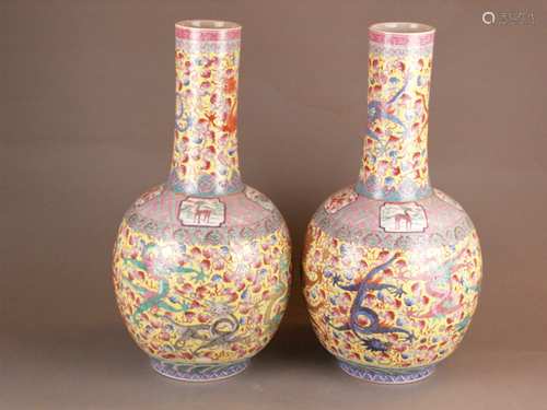 Pair of floor vases - China, 20th century, Tian qiu ping type, lush decor in polychrome<br />enamel colors, on the wall and neck large five-claw dragons among lingzhi clouds on yellow background ,  on the shoulder and neck base various ornamental borders and cartouches with fabulous animal pictures in them, meander band on the rim, zigzag border on the stand, red bottom mark with golden characters ''Da Qing Qianlong Nian Zhi'', H.ca.58cm