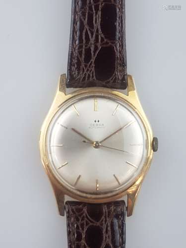 Ladies' wristwatch Oebra - Switzerland, automatic movement, 14 ct yellow gold case,<br />hallmarked 0.585, backside with monogram ''HC'' and date ''24.12.1969'', no. 85174, silver dial with gold index, golden hands, functioning, D.ca.35mm, crocodile leather strap