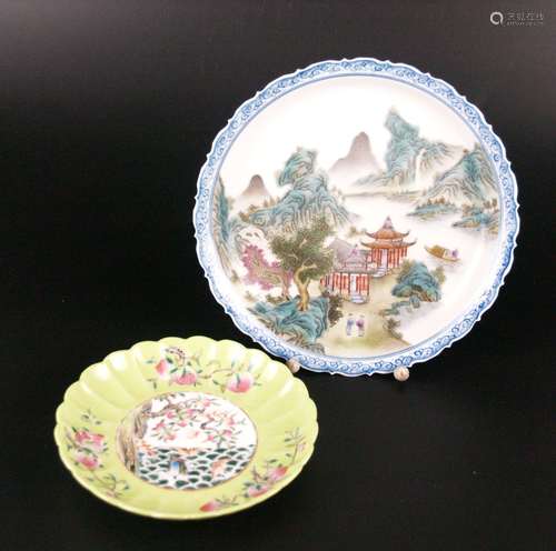 Two plates - China 20zj cent., porcelain with polychrome enamel decoration, 1x with<br />Shan-Shui landscape and blue painted rim, Dm.ca.21cm, blue Zhuanshu-bottom mark ''Yongzheng Nian Zhi'' / 1x green background with fruit branches (peaches, pomegranates, litchi fruits) inside Wu Fu motif outside (5 bats), in the well peach tree, waves and bats, minimally rubbed, Dm.ca.16cm, bottom with 6-character mark ''Da Qing Yongzheng Nian Zhi'' in the double ring