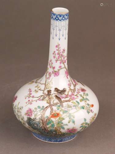 Vase - China, 20th century, porcelain with Famille rose decor:flock of birds among<br />flowering branches and flowers, meandering border around the foot, on the lip Ruyi heads with suspensions, in the bottom blue Zhuanshu mark ''Qianlong Nian Zhi '', H.ca.19cm, gold rim partly rubbed