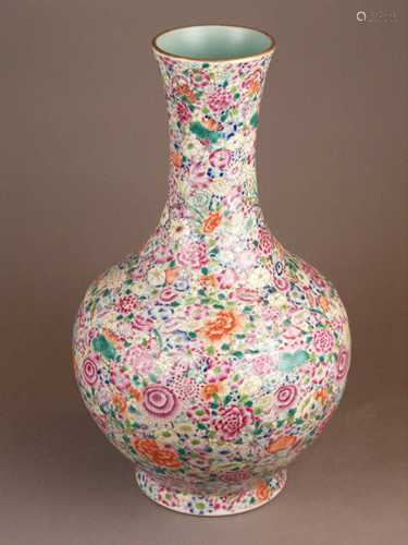 Vase with ''hundred flower'' ground - China, late Qing-dynasty, porcelain with overglaze<br />polychrome ''fencai'' decoration and red six character mark''Da Qing Daoguang Nian Zhi'', gilt on the rim slightly worn,H..43cm, weight c.3653g