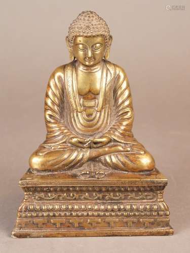 Buddha Amitabha - Bronze, gilded, in meditation in Padmasana on a high trapezoidal base,<br />the hands in Dhyana Mudra, one-piece hollow cast, opened base, Nepal / early 20th century, H.ca.21cm