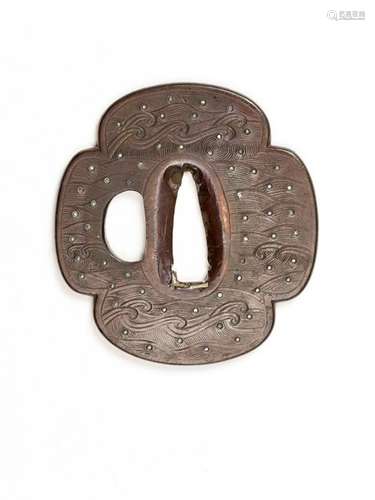 AN IRON MOKKUGATA TSUBA WITH WAVES AND SILVER INLAY