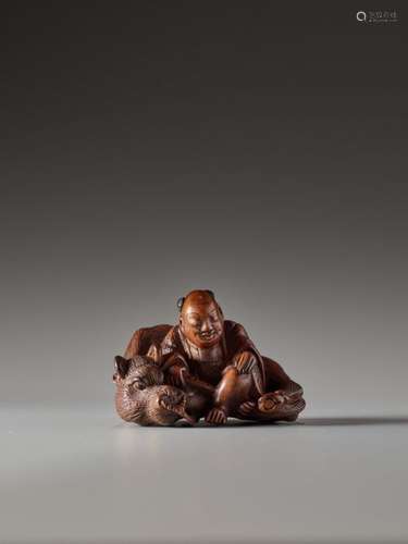 A WOOD NETSUKE OF AN OX HERDER BY MASASHIGE