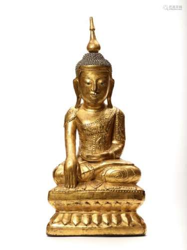 A BURMESE LACQUER GILT WOOD FIGURE OF A SEATED BUDDHA, …