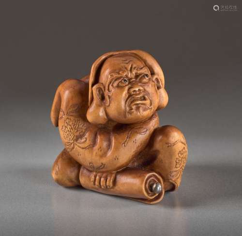 A BOXWOOD NETSUKE BY ALEXANDER DERKACHENKO OF DARUMA