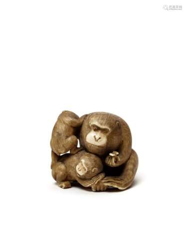 AN IVORY NETSUKE OF A MONKEY WITH YOUNG