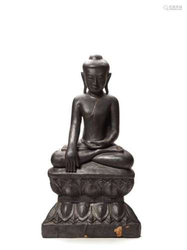 A BURMESE BLACK LACQUERED WOOD FIGURE OF A SEATED BUDDH…