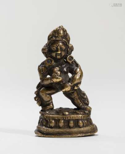 A TIBETAN MINIATURE BRONZE OF KUBERA, 18TH 19TH CENTURY