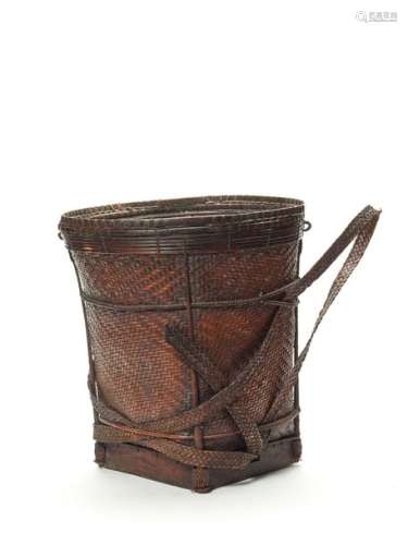 A BURMESE HANDWOVEN BASKET WITH TWO HANDLES, 1ST HALF O…