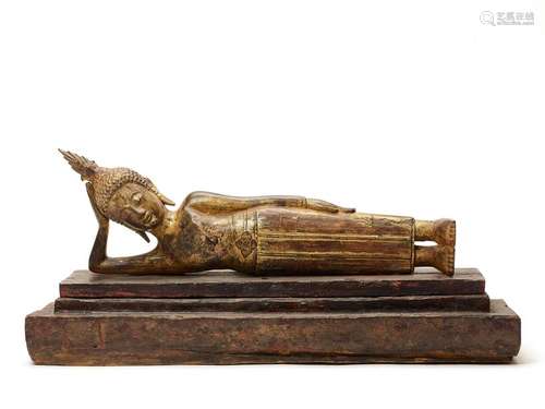 A BURMESE LACQUER GILT WOOD FIGURE OF A RECLINING BUDDH…