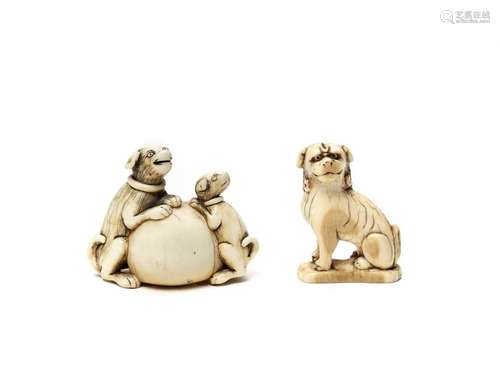 TWO IVORY NETSUKE DEPICTING DOGS