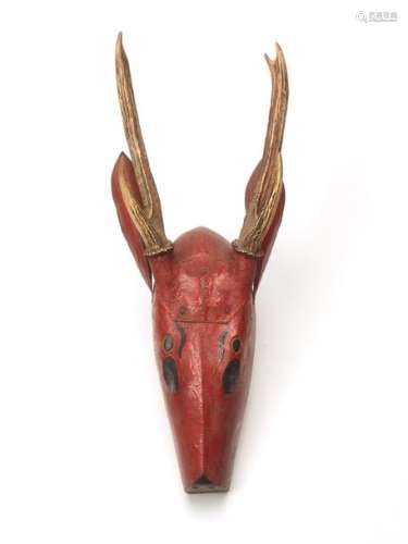 A BURMESE RED LACQUER WOODEN WALL MASK OF A DEER WITH R…