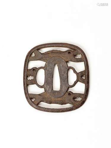 AN IRON SUKASHI TSUBA WITH DRIED FISH