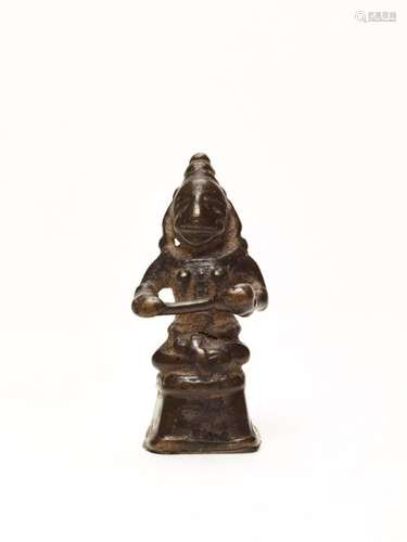 AN INDIAN MINIATURE BRONZE OF A DEITY, 15TH-17TH CENTURY