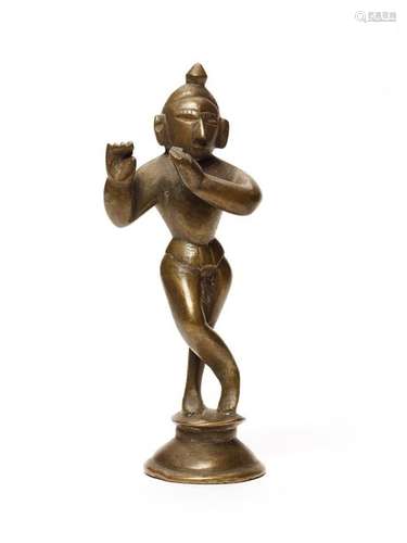 AN EARLY STATUE OF KRISHNA PLAYING THE FLUTE, INDIA, 16th-17th CENTURY