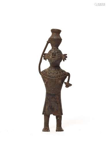 AN INTERESTING KONDH TRIBAL BRONZE OF A FEMALE FIGURE CARRYING A BASKET ON HER HEAD