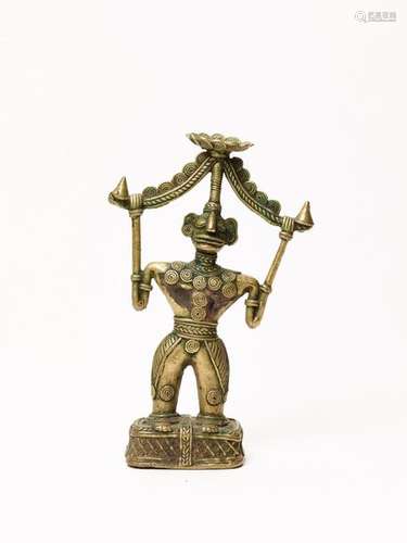 A BASTAR BRONZE OF A GODDESS HOLDING A VAHADI