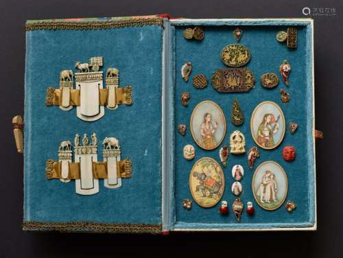 A COLLECTION OF MINIATURE COLLECTIBLES IN CASE