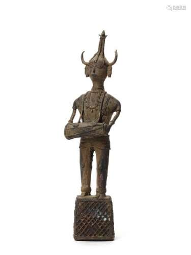 A RARE AND LARGE KONDH TRIBAL BRONZE OF A WARRIOR HOLDING A DRUM