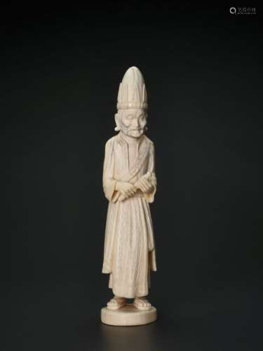 A 19TH CENTURY INDO-PERSIAN IVORY SCULPTURE OF A PRIEST