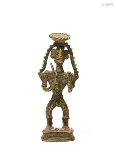 A BASTAR BRONZE OF A FEMALE DEITY WITH TRIDENT AND SCEPTRE