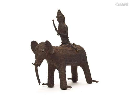 A KONDH TRIBAL BRONZE GROUP OF A WARRIOR RIDING AN ELEPHANT