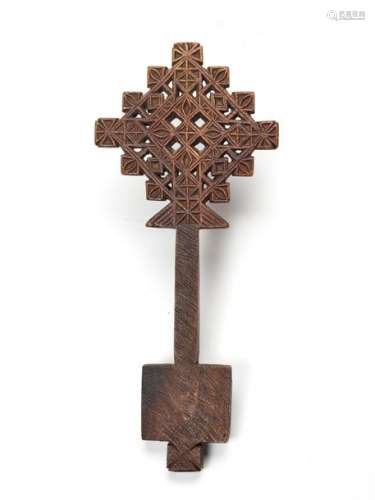 AN ETHIOPIAN PROCESSIONAL CROSS, CARVED AND OPENWORKED WOOD, 19TH CENTURY