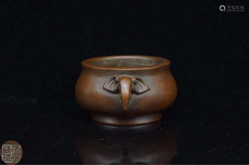 AN ELEPHANT-HANDLE COPPER CENSER