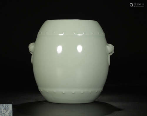 A TIANQING CELADON DRUM SHAPED JAR