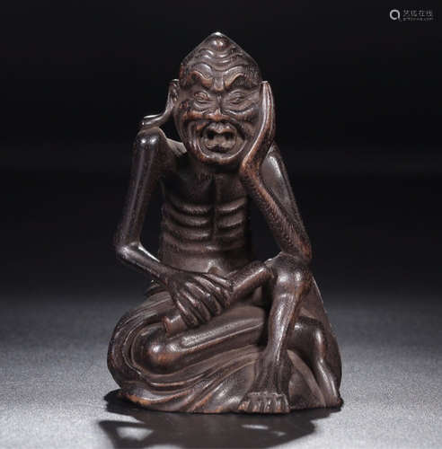 A ZITAN WOOD CARVED LUOHAN FIGURE