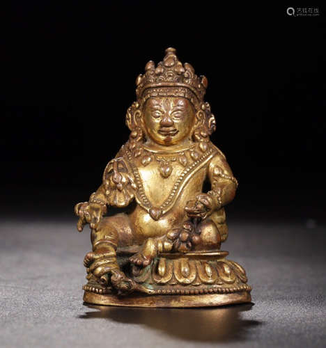 A GILT BRONZE HUANGCAISHEN BUDDHA