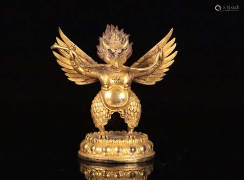 A GILT BRONZE DAPENGHUFA FIGURE