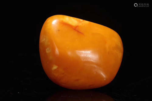 AN AMBER ORNAMENT