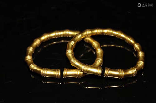 A PAIR OF SILVER GOLD-GILT BRACELET