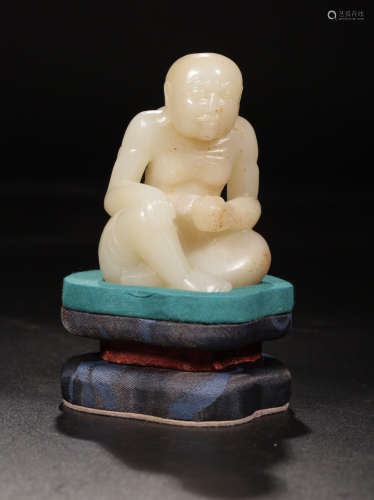 A HETIAN ZILIAO CARVED LUOHAN FIGURE