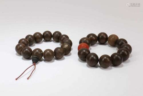 Two Chinese Chenxiang Wood Bracelets