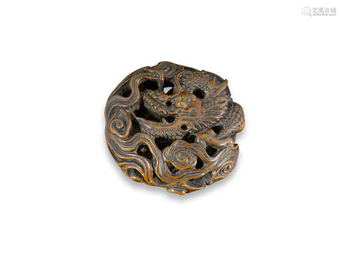 A wood manju netsuke of a dragonEdo period (1651-1868), 19th century  Hirohide (active 19th century)