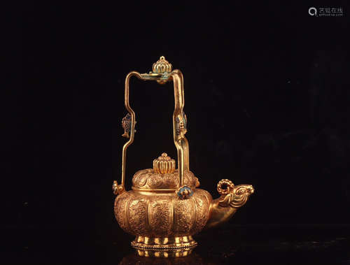 17-19TH CENTURY, A GUILT BRONZE GOAT HEAD DESIGN LOOP-HANDLED TEAPOT, QING  DYNASTY.