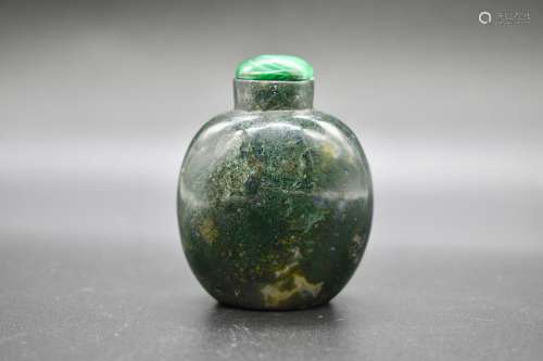 A round Chinese jadeite snuff bottle